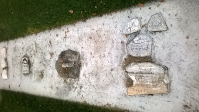 row of broken tombstones